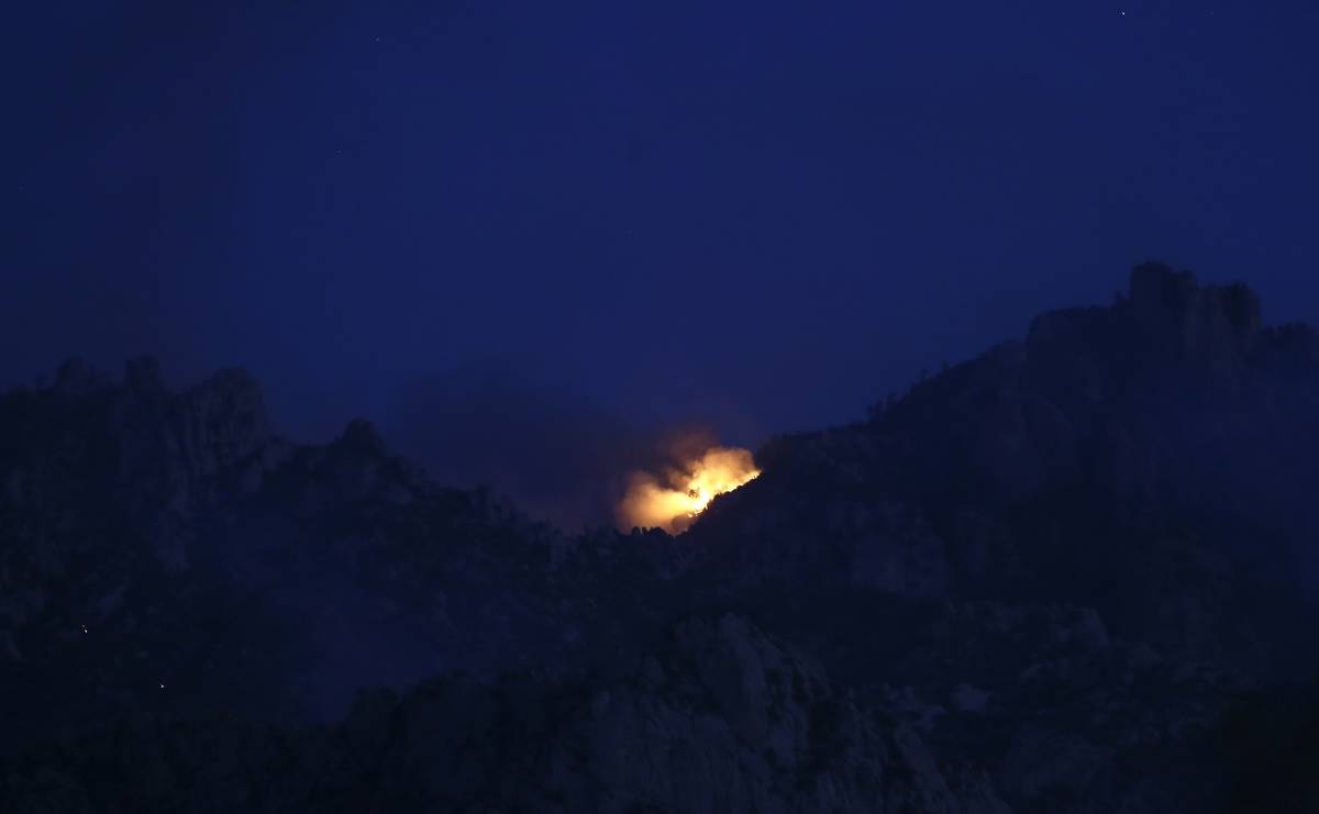 The Bighorn Fire moves along the western side of the Santa Catalina Mountains, Sunday, June 14, ...