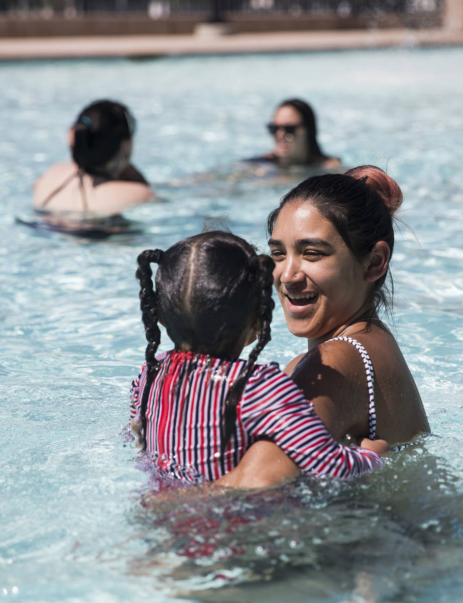 Zhasani Myers plays with her daughter Zarah Mitchell, 3, at Garside Pool in Las Vegas, Monday, ...