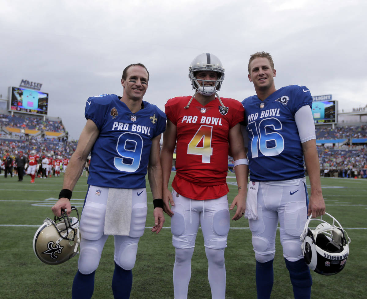 New Orleans Saints quarterback Drew Brees (9), Oakland Raiders quarterback Derek Carr (4) and L ...