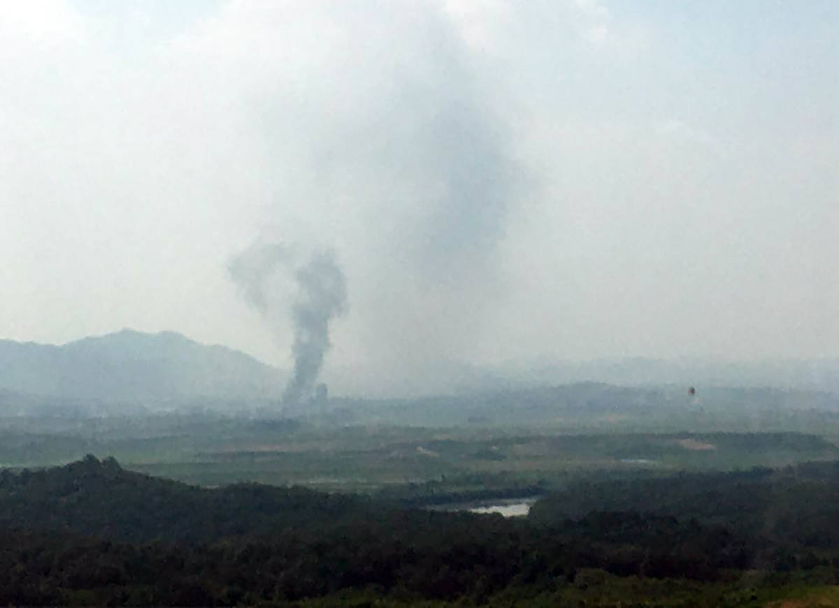 Smoke rises in the North Korean border town of Kaesong, seen from Paju, South Korea, Tuesday, J ...