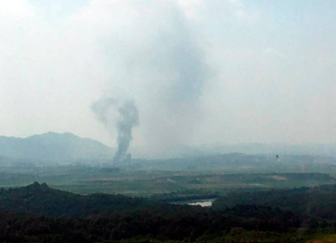 Smoke rises in the North Korean border town of Kaesong, seen from Paju, South Korea, Tuesday, J ...