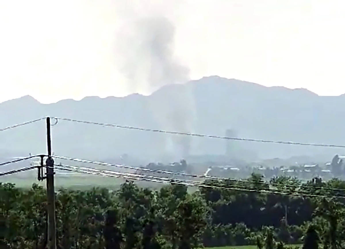 Smoke raising in the North Korean border town of Kaesong is seen from Paju, South Korea, Tuesda ...