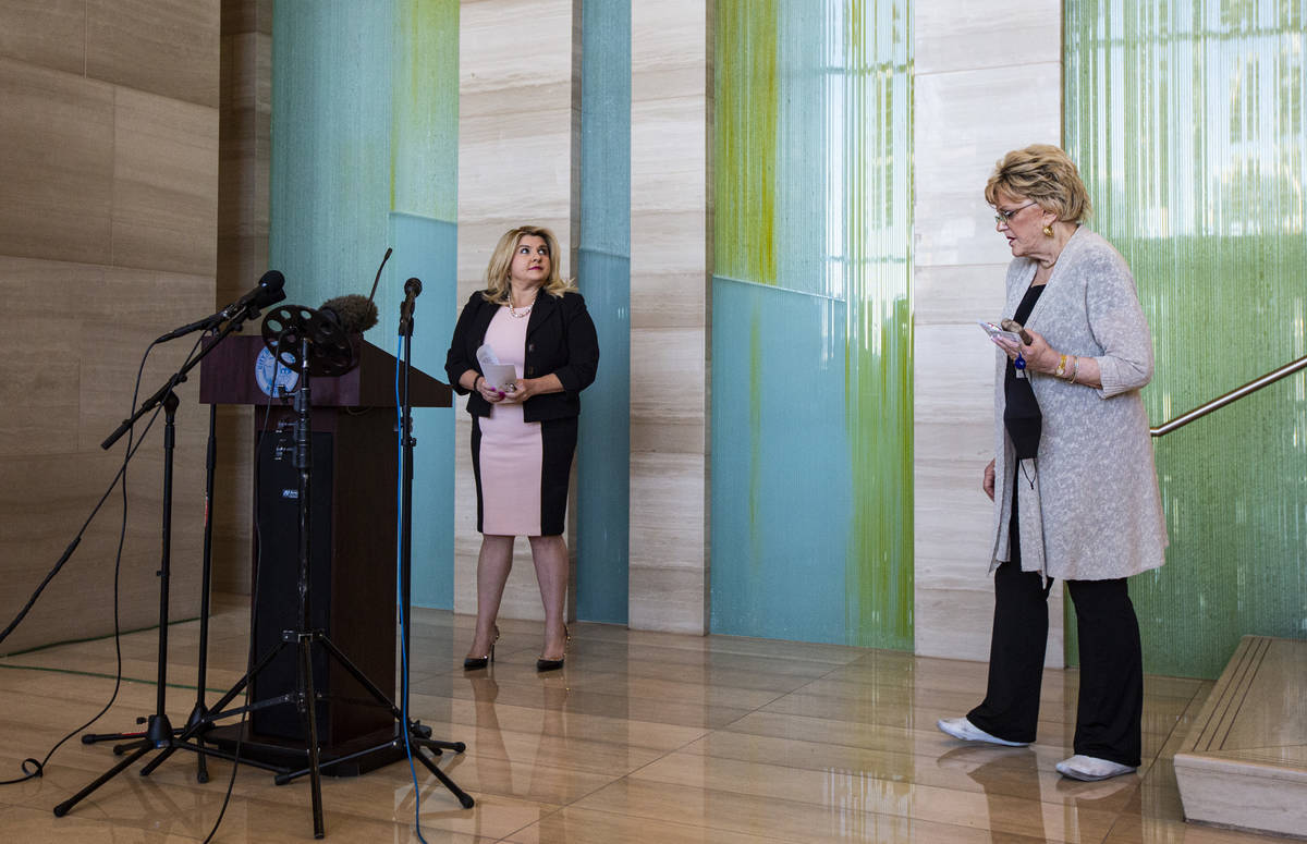 Las Vegas City Councilwoman Michele Fiore, left, looks on after a press conference announcing t ...