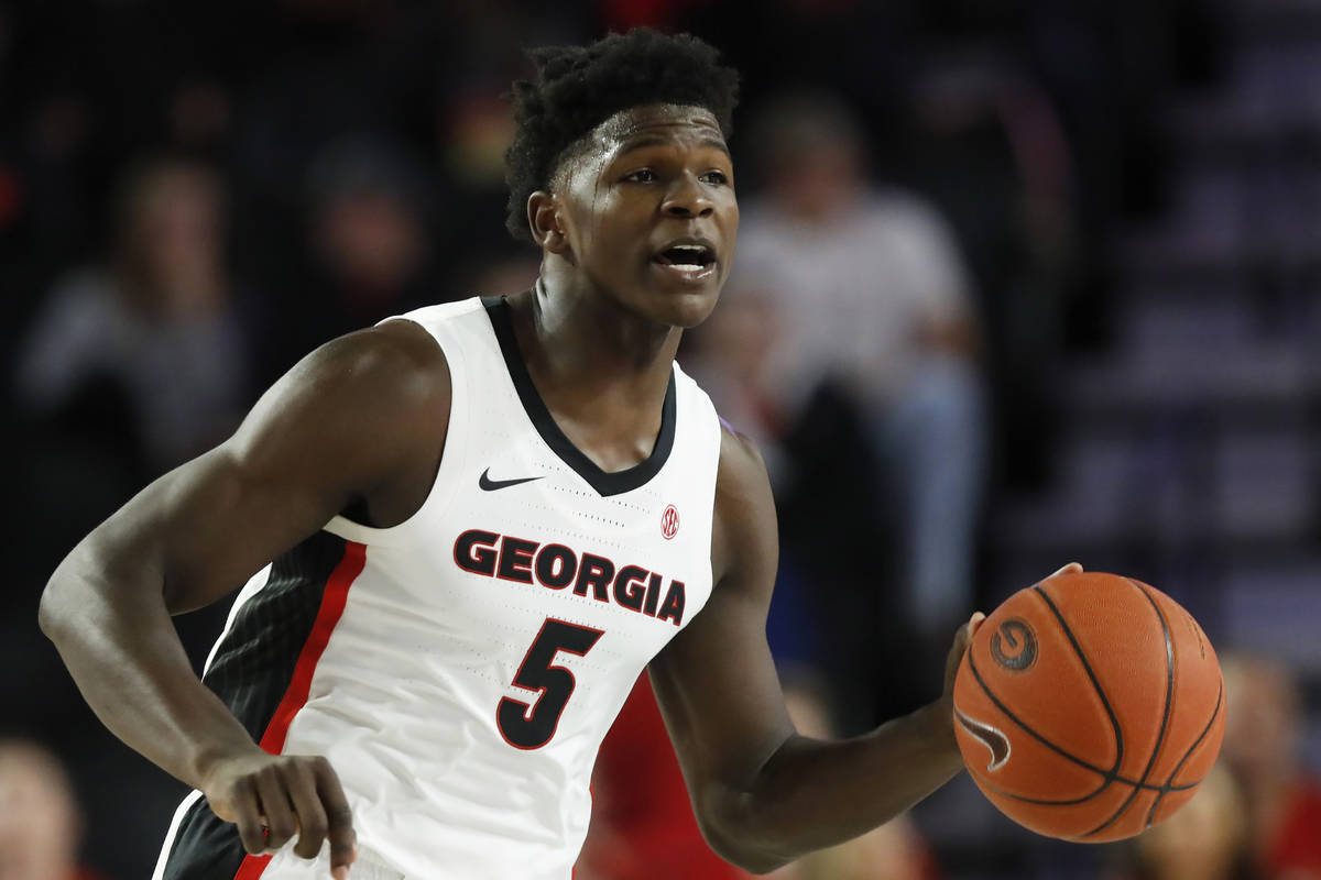 In this Friday, Oct. 18, 2019, file photo, Georgia's Anthony Edwards (5) dribbles the ball up d ...