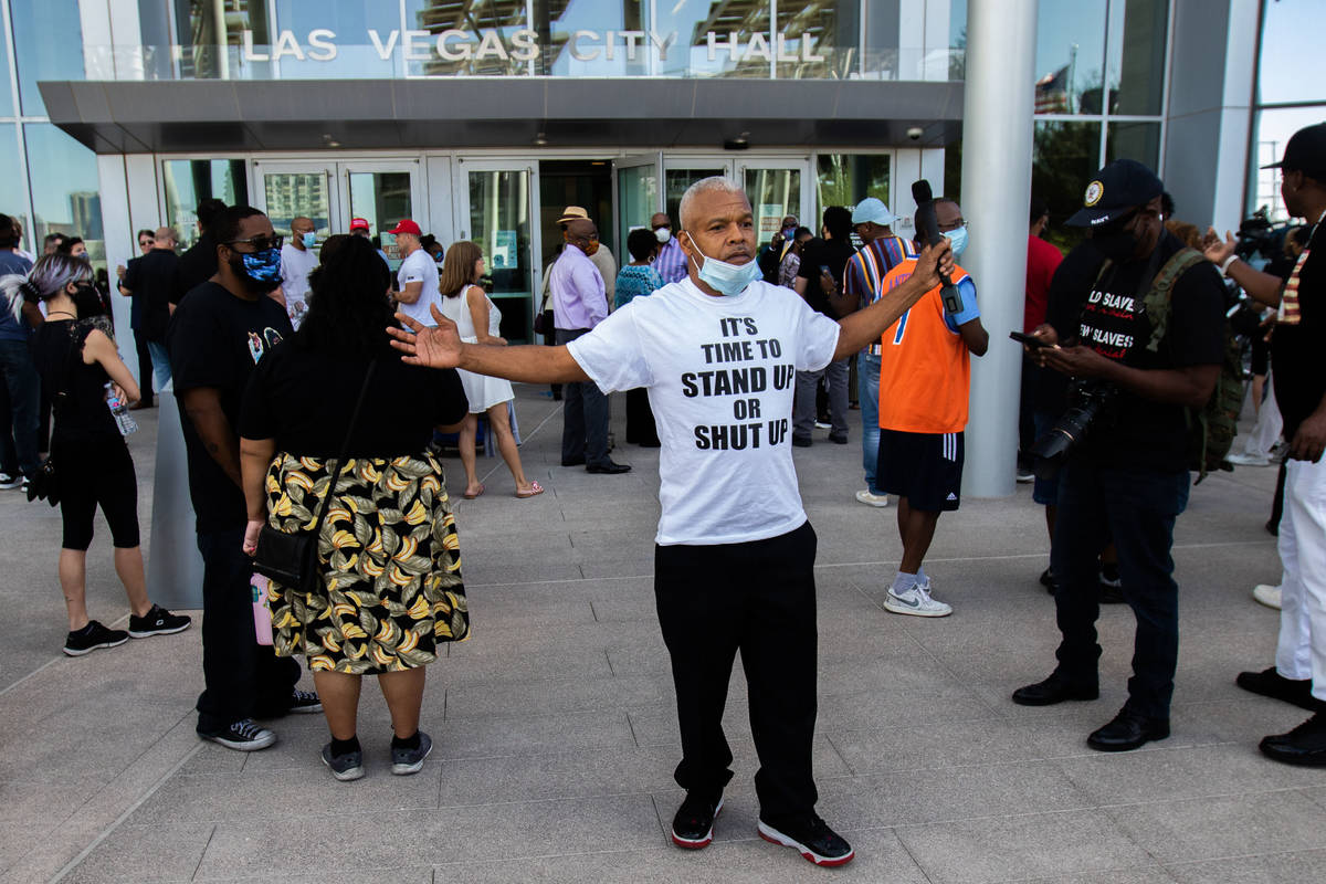 Henry Thorns gives an interview at an NAACP protest in front of Las Vegas City Hall on Wednesda ...