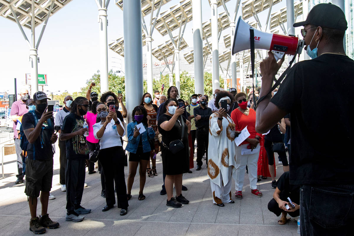 The Rev. Stretch Sanders speaks to protesters at an NAACP protest in front of Las Vegas City Ha ...