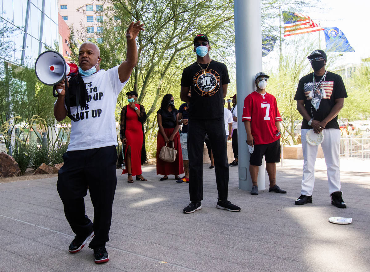 Henry Thorns speaks to a crowd of protesters at an NAACP protest in front of Las Vegas City Hal ...