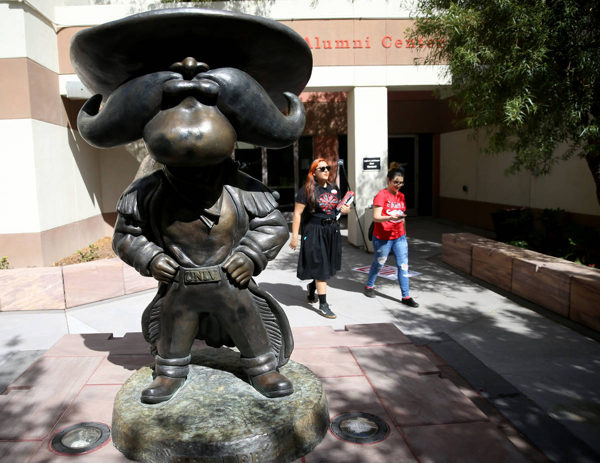 Students walk past a statue UNLV mascot Hey Reb! on campus Friday, Aug. 23, 2019. (K.M. Cannon/ ...