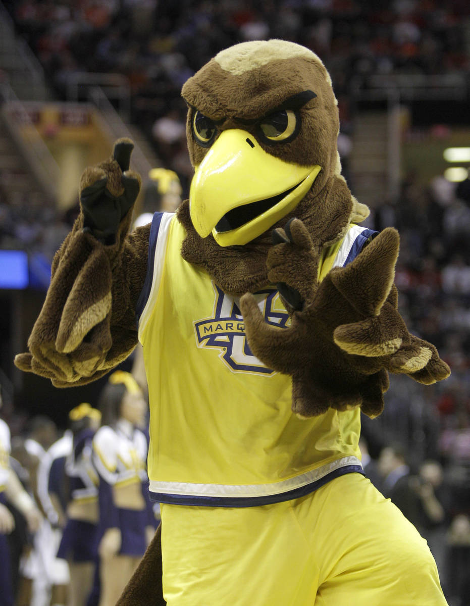 The Marquette mascot dances on the court as the team takes on Xavier in an East regional NCAA c ...