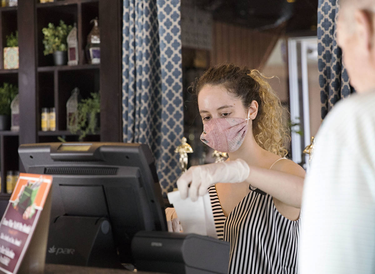 Clea Ciccone helps a customer at Paymon's, a Mediterranean restaurant, in Las Vegas, Sunday, Ma ...