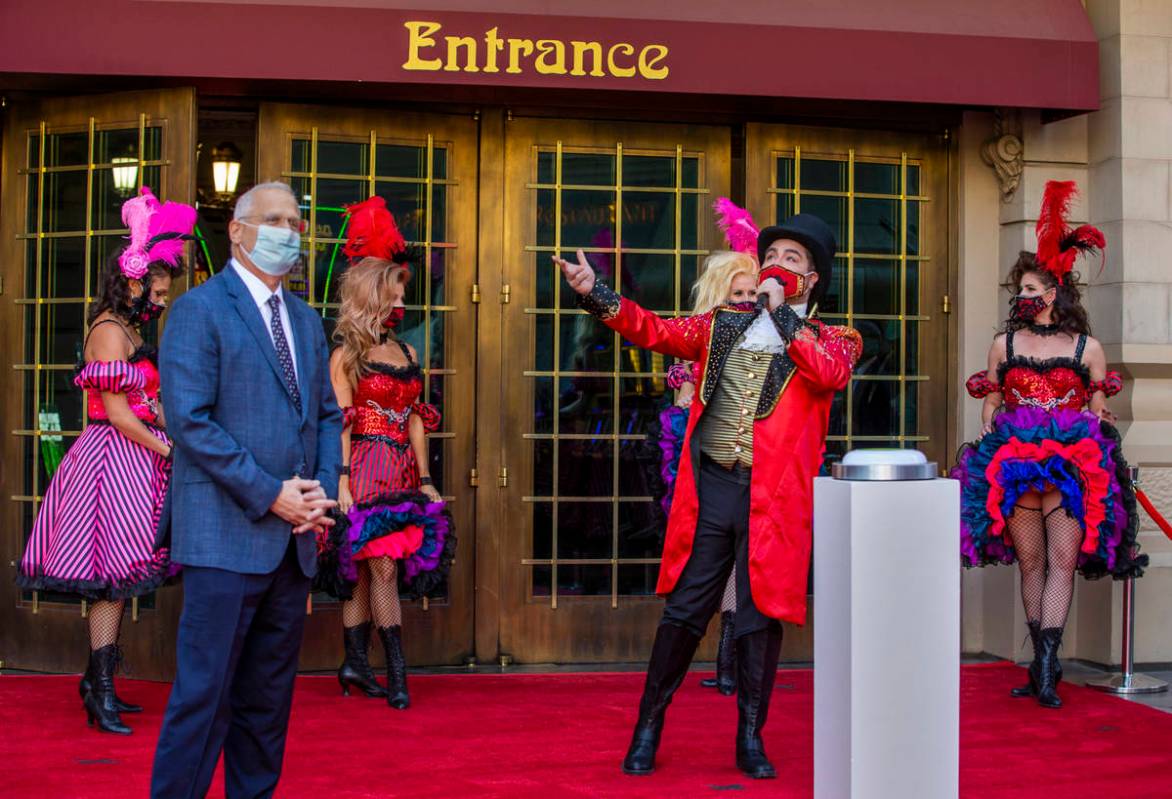 Paris Las Vegas Regional President Gary Selsner, left, looks on as a Monsieur Loyal ringmaster ...