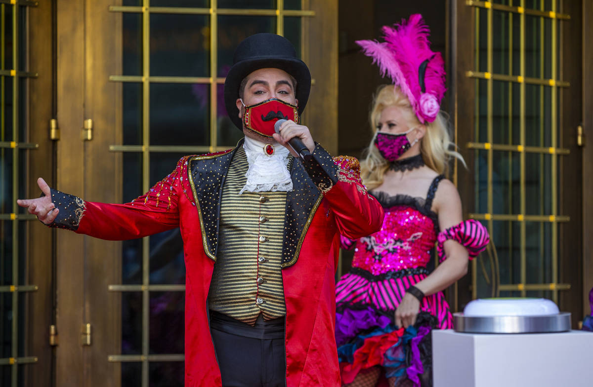 A Monsieur Loyal ringmaster greets those gathered outside the entrance of the Paris Las Vegas t ...