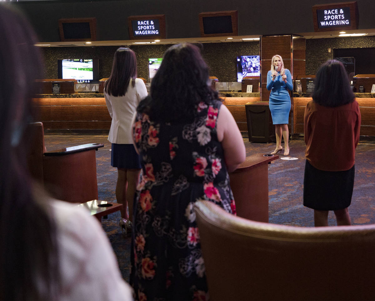 Cami Christensen, general manager and president of Westgate Las Vegas, addresses employees befo ...