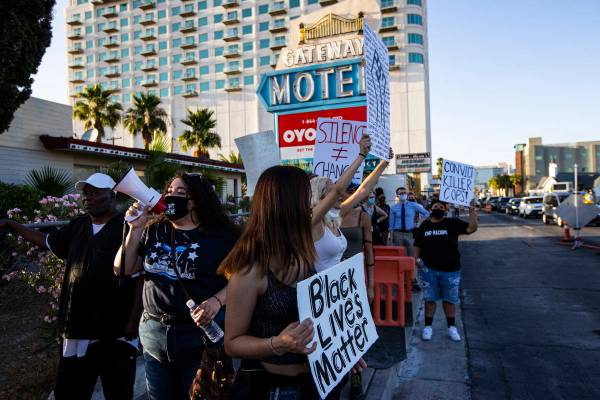 People participate in a Black Lives Matter protest along Las Vegas Boulevard on Wednesday, June ...