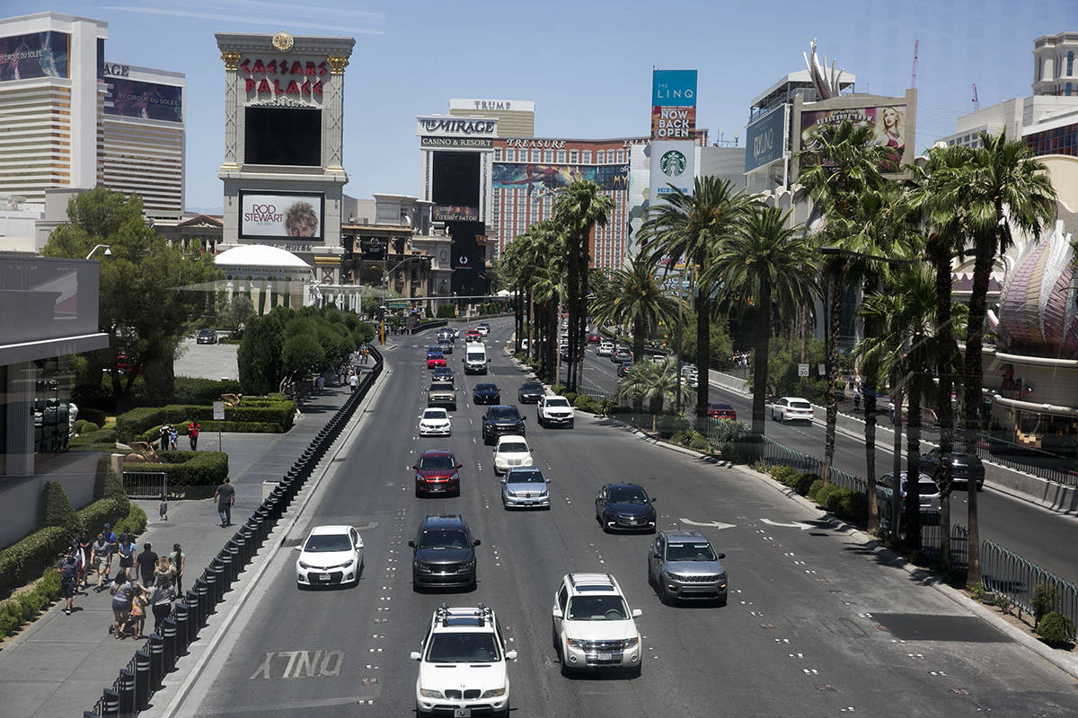 Pedestrians, left, and motorists on Las Vegas Boulevard on Sunday, June 7, 2020, in Las Vegas. ...