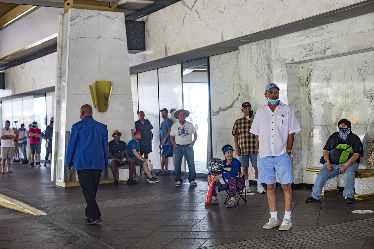 Guests wait in line for the reopening of the Westgate after the months long coronavirus closure ...