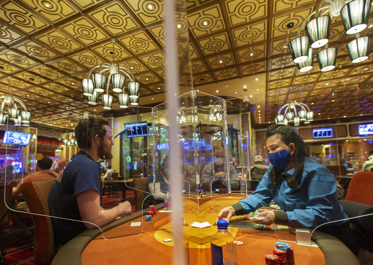 The Bellagio poker room is packed after being outfitted with shielding and upgraded sanitation ...