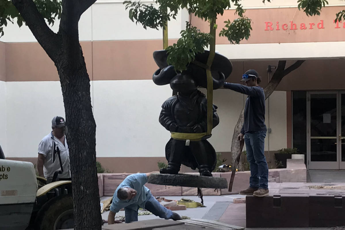 UNLV workers remove the Hey Reb! statue from in front of the Tam Alumni Center on Tuesday, June ...