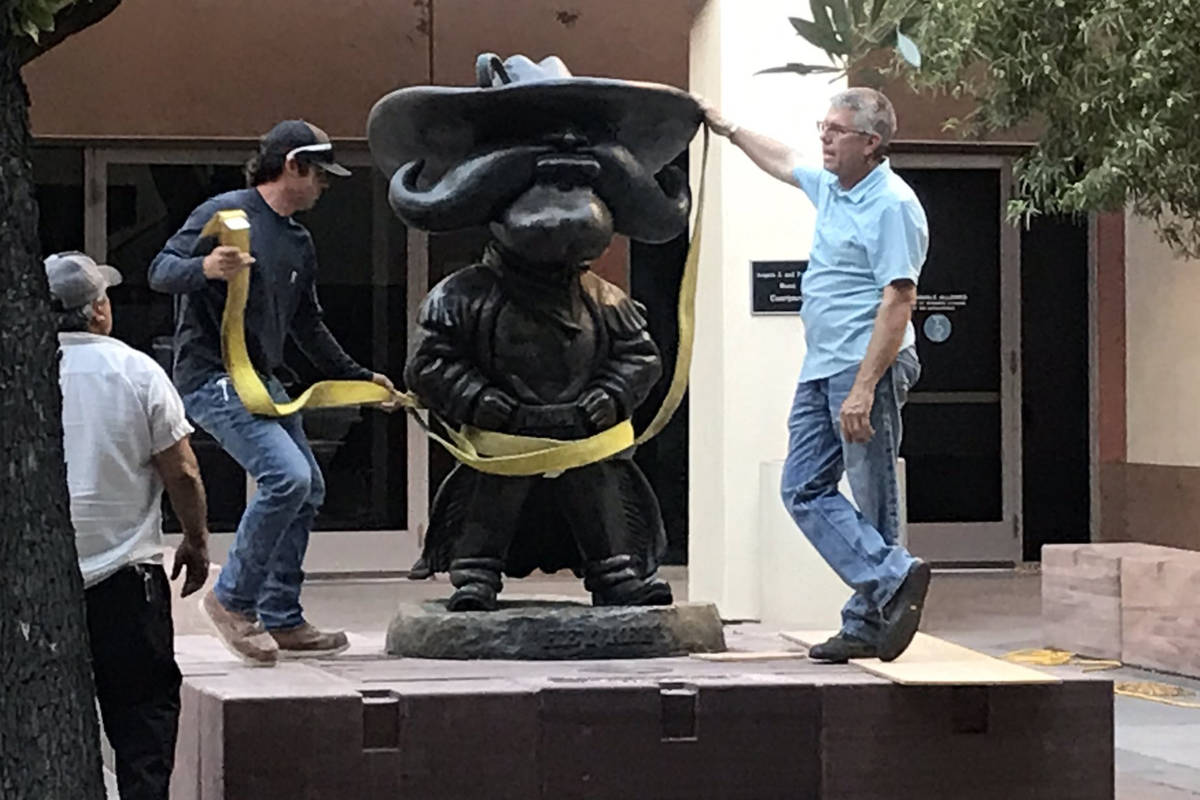 UNLV workers remove the Hey Reb! statue from in front of the Tam Alumni Center on Tuesday, June ...