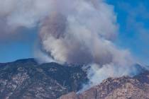 The Bighorn Fire burning in canyons below Mt. Lemmon, the highest spot in the Santa Catalina Mo ...
