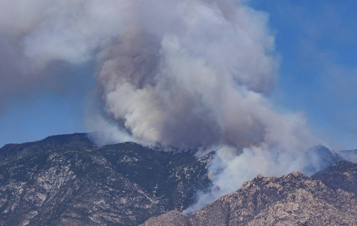 The Bighorn Fire burning in canyons below Mt. Lemmon, the highest spot in the Santa Catalina Mo ...
