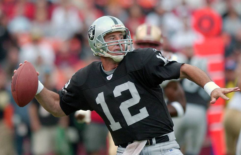 **FILE**Oakland Raiders quarterback Rich Gannon passes in front of a San Francisco 49ers player ...