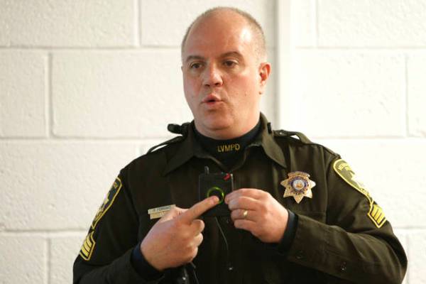 Las Vegas police Sgt. Peter Ferranti demonstrates the department's body cameras during a media ...