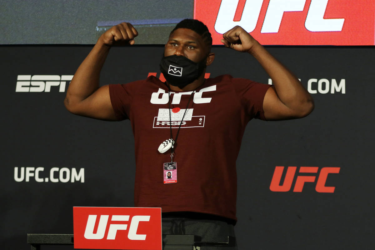 UFC heavyweight Curtis Blaydes poses on the scale at weigh-ins at the UFC Apex in Las Vegas, Fr ...