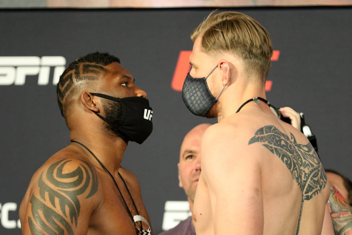 UFC heavyweights Curtis Blaydes, left, faces off against Alexander Volkov, right, as UFC presid ...