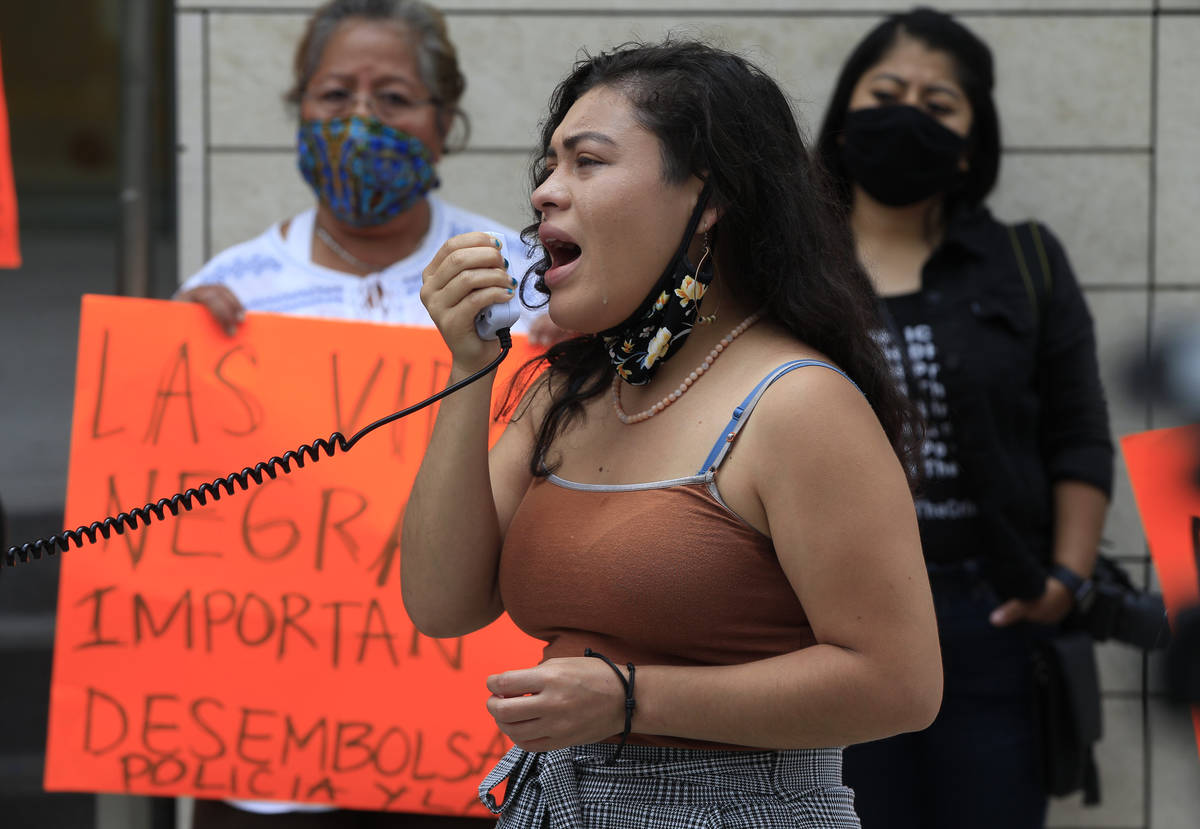 Immigration activist Claudia Rueda tears up as she addresses young immigrants celebrating the D ...