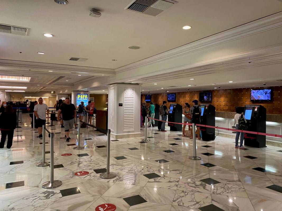 Guests wait to check in at the Flamingo. (Al Mancini/Las Vegas Review-Journal)