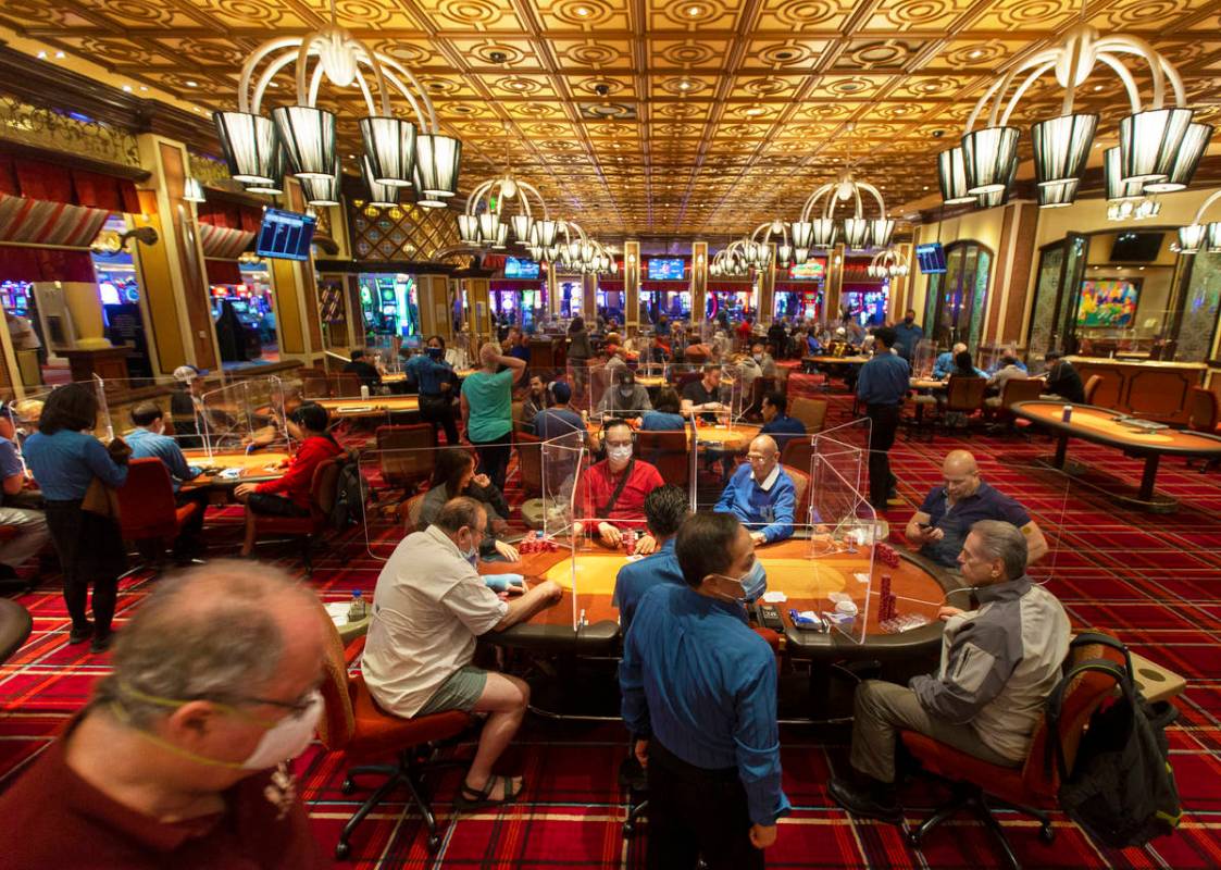 The Bellagio poker room is packed after being outfitted with shielding and upgraded sanitation ...