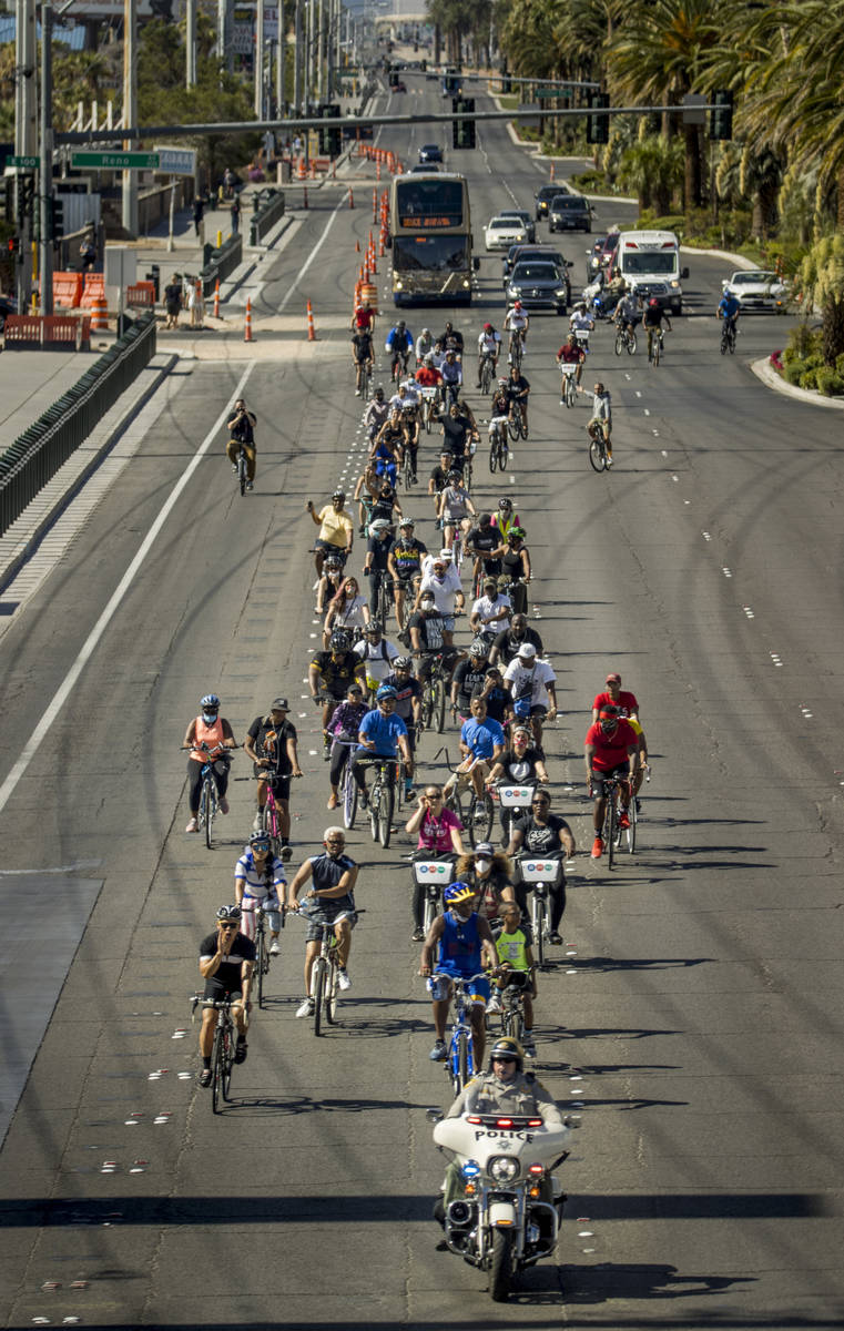 Participants in a Black Lives Matter bike ride against injustice turn at Mandalay Bay to head b ...