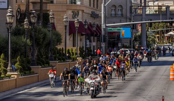 Participants in a Black Lives Matter bike ride against injustice pass The Palazzo while heading ...
