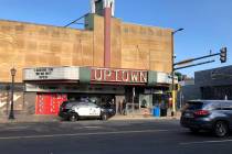 A police vehicle is parked outside the Uptown Theatre Sunday, June 21, 2020, following a shooti ...