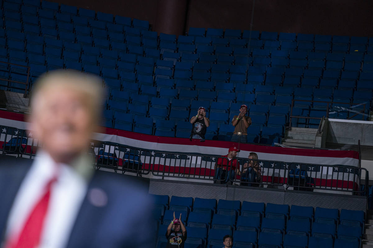 President Donald Trump supporters cheer as Trump speaks during a campaign rally at the BOK Cent ...