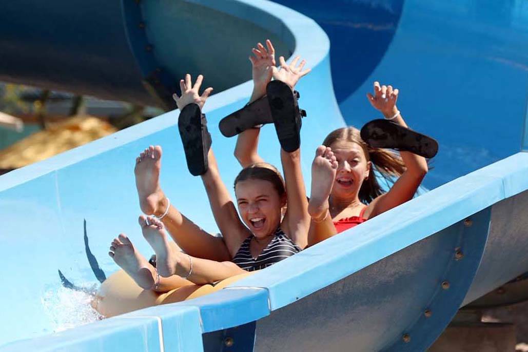 People ride Zipp Zapp Zoom on opening day of Wet 'n' Wild water park in Las Vegas Monday, June ...