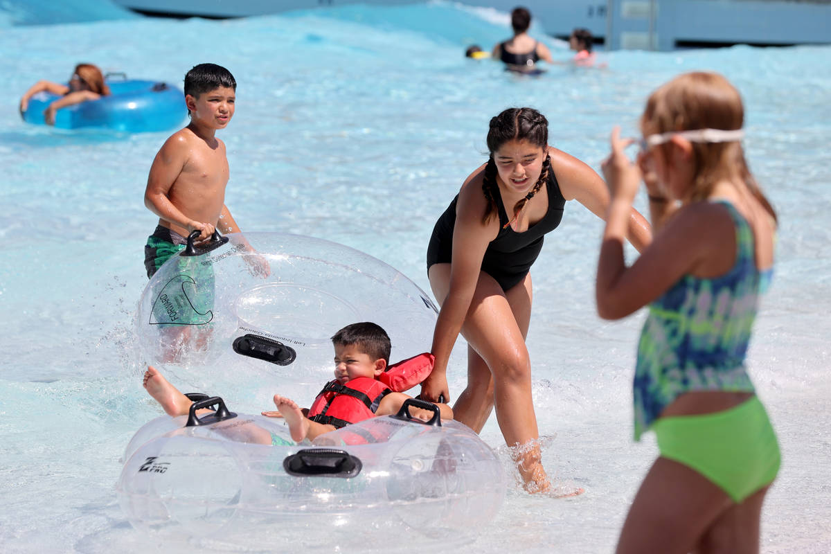 People play in Red Rock Bay on opening day at Wet 'n' Wild water park in Las Vegas Monday, June ...