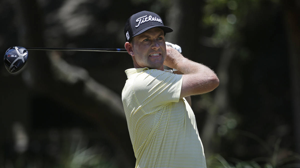 Webb Simpson hits off the second tee during the final round of the RBC Heritage golf tournament ...