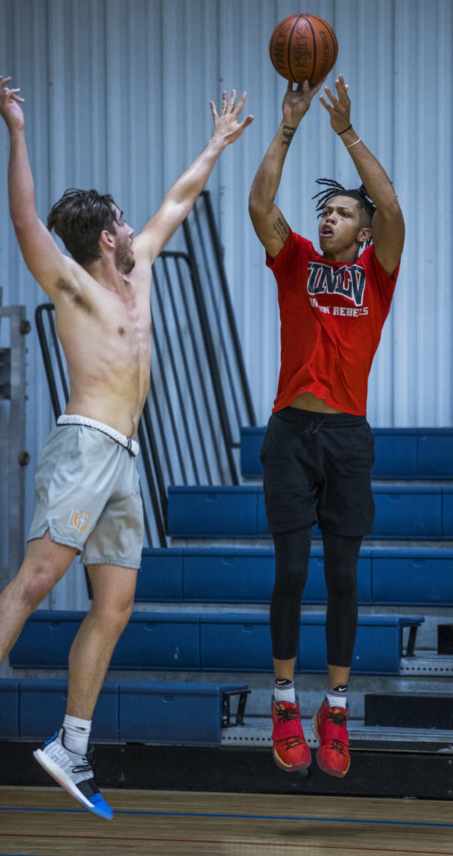 UNLV freshman wing Nick Blake, right, is defended by Braden Lamar on the court at the Tarkanian ...