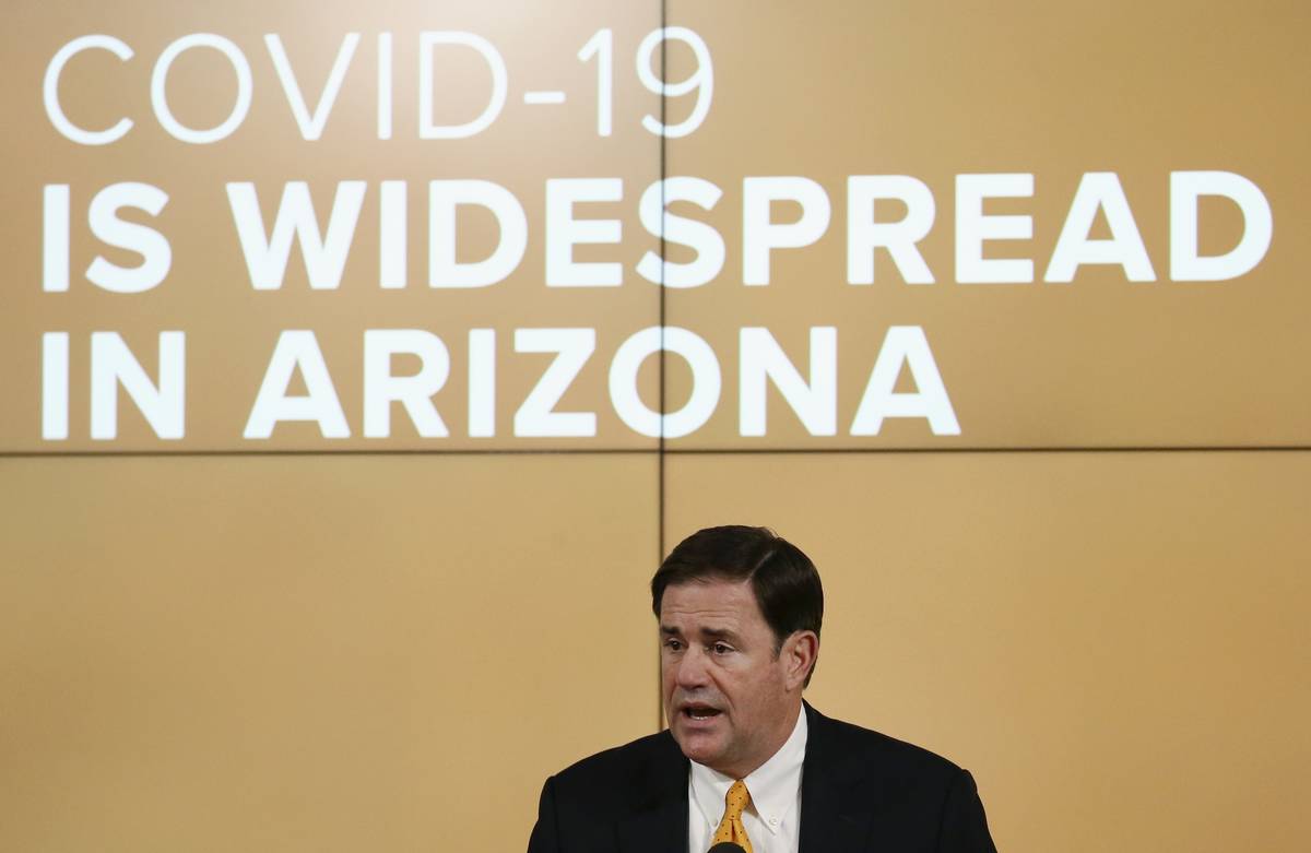 Arizona Republican Gov. Doug Ducey speaks about the latest coronavirus data at a news conferenc ...