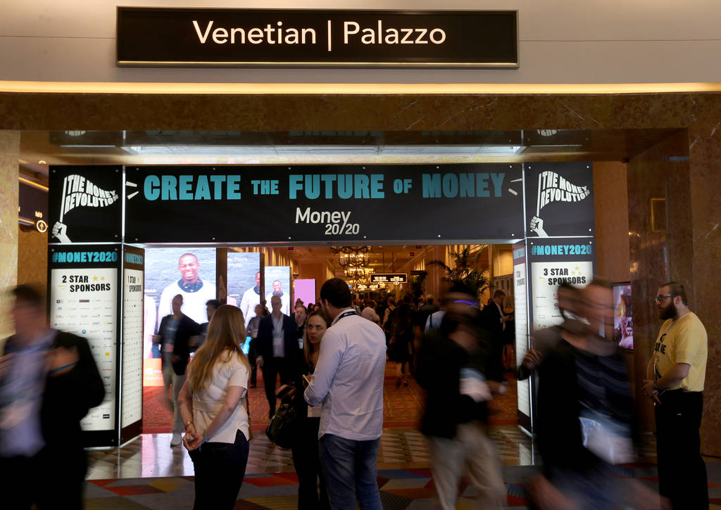 Conventioneers mingle at the Money 20/20 show at the Venetian in Las Vegas Tuesday, Oct. 23, 20 ...