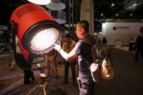 Filmmaker Paul Chou of Taiwan demonstrates Mole-Richardson's Vari-Tener 10k LED movie light dur ...