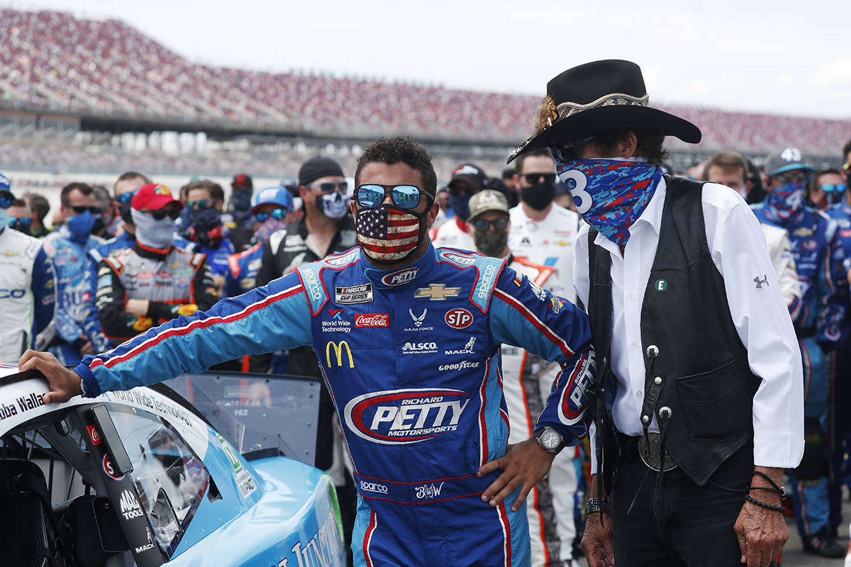 Team owner Richard Petty, right, stands with driver Bubba Wallace prior to the start of the NAS ...