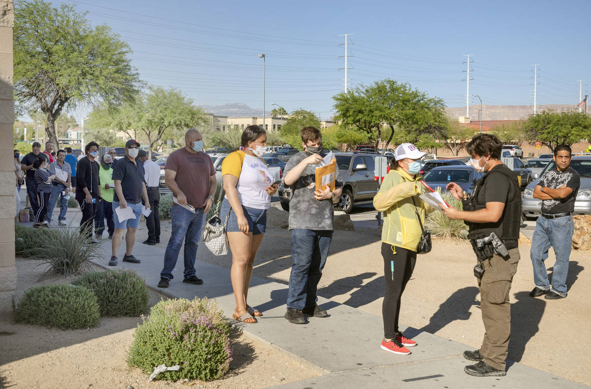 People wait in line at the Nevada Department of Motor Vehicles at 8250 West Flamingo Road, Las ...