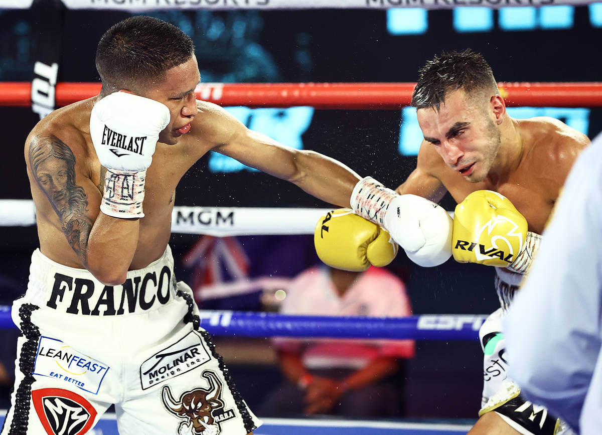 Joshua Franco, left, lands a left punch against Andrew Moloney on Tuesday, June 23, 2020, at th ...
