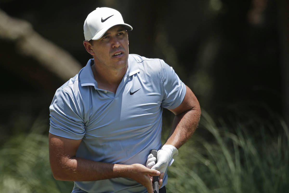 Brooks Koepka watches his shot off the second tee during the final round of the RBC Heritage go ...