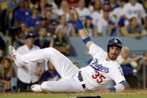 Los Angeles Dodgers' Cody Bellinger (35) scores against the Los Angeles Angels during a basebal ...