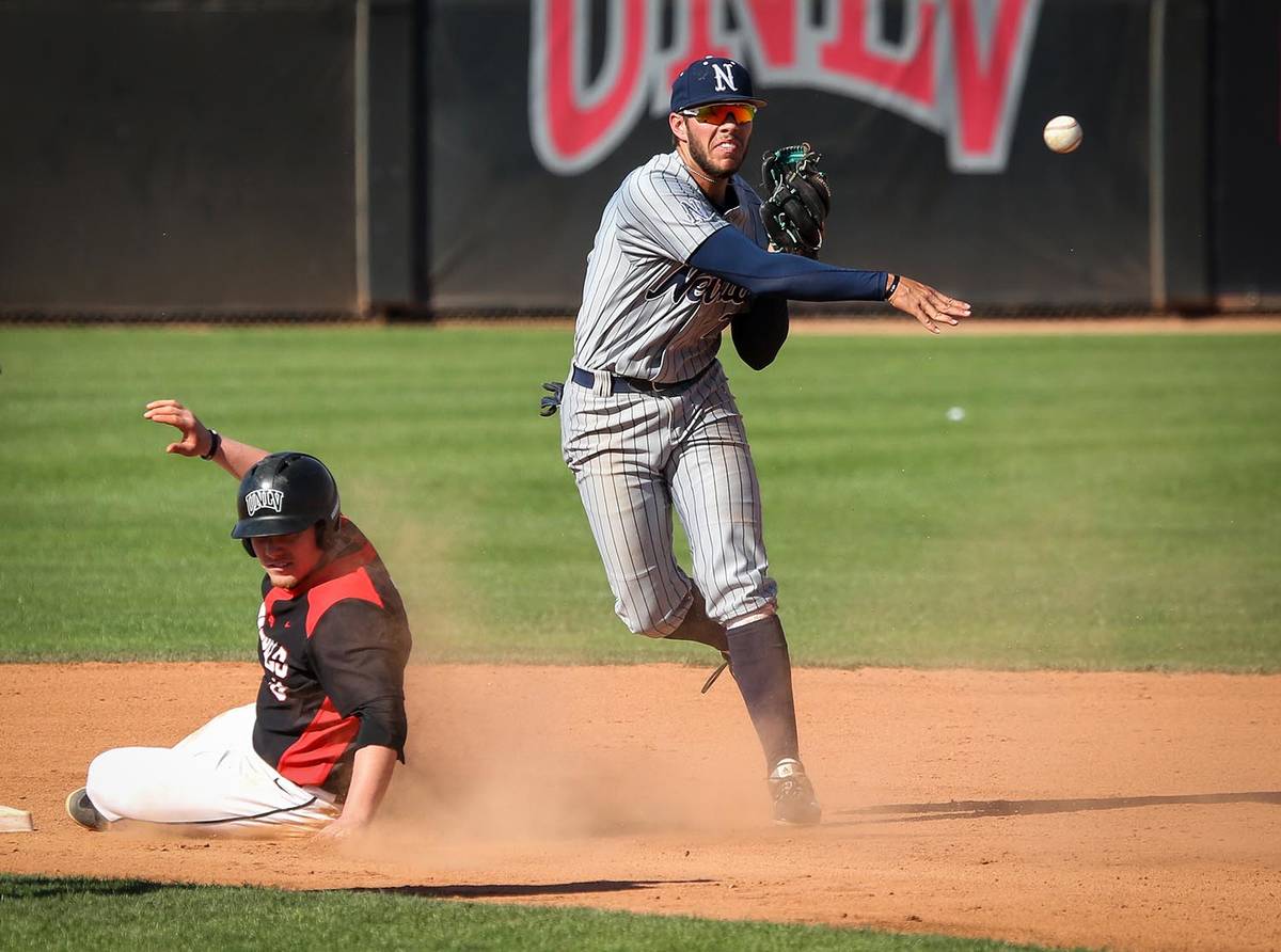 Special to the Pahrump Valley Times UNR infielder Wyatt Tilley throws to first base after forci ...
