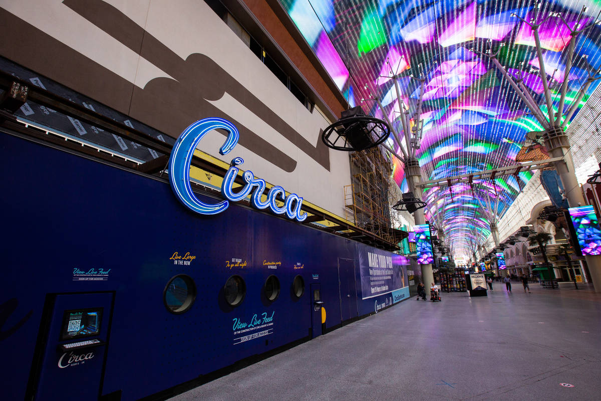 People walk by where Circa will be located under the Freemont Street Experience in Las Vegas on ...
